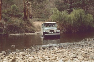 JCD driving our short wheel-base Toyota Land Cruiser across one of many river crossings, March 1973
